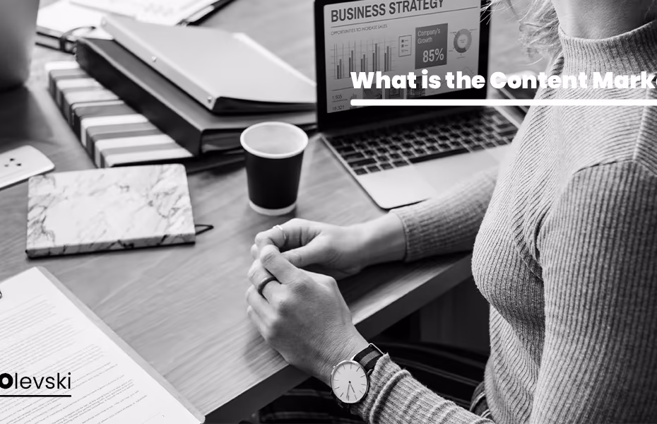 Professional working on a laptop with business analytics and documents, illustrating the role of an SEO Consultant for Bloggers in content strategy and performance analysis.