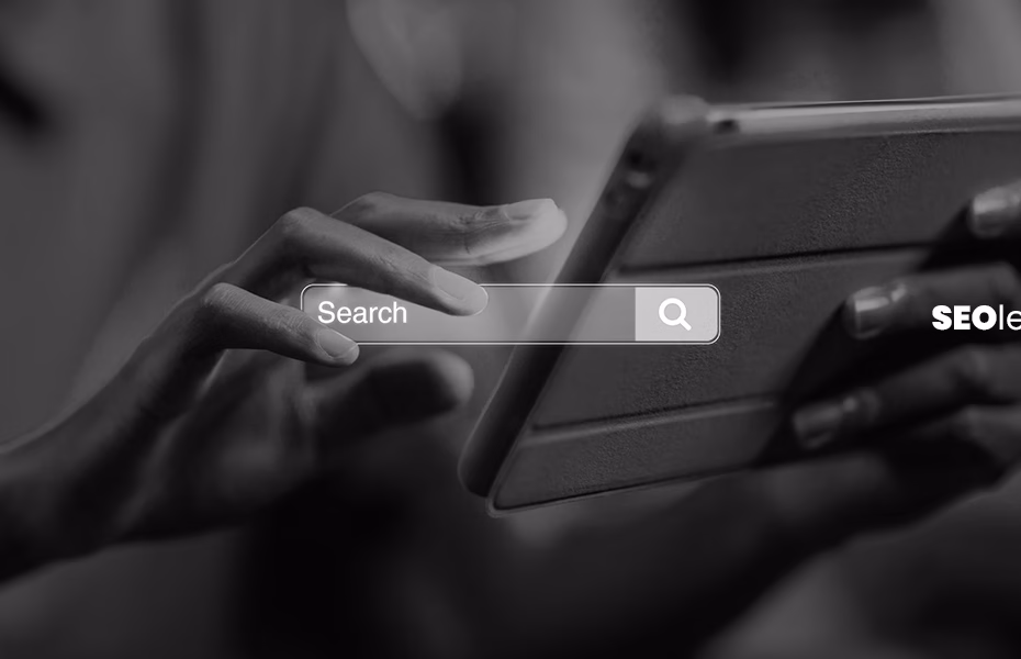 Person using a tablet with a search bar overlay, representing Google SEO and mobile search behavior in a digital environment.